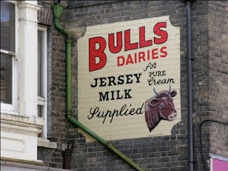 Bull Dairies painted sign on wall by Nick Stenning