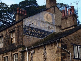 Hand painted sign on building for the Royal Oak Inn