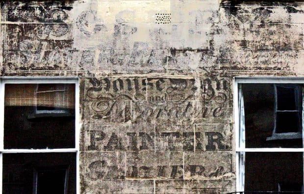 Enhanced image of hand painted sign on building in Bath