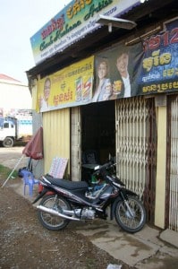 Signpainters shop entrance in Kratie Cambodia
