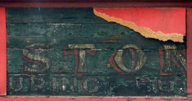Fragment of hand-painted sign for Lewis Stone