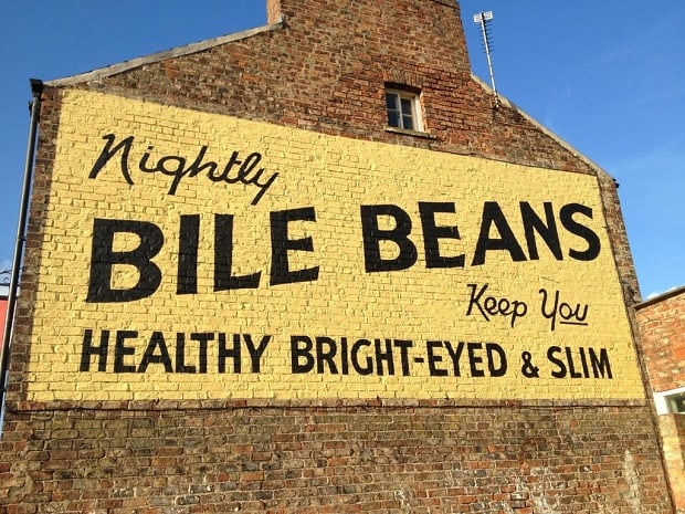 Painted sign on a wall advertising Bile Beans