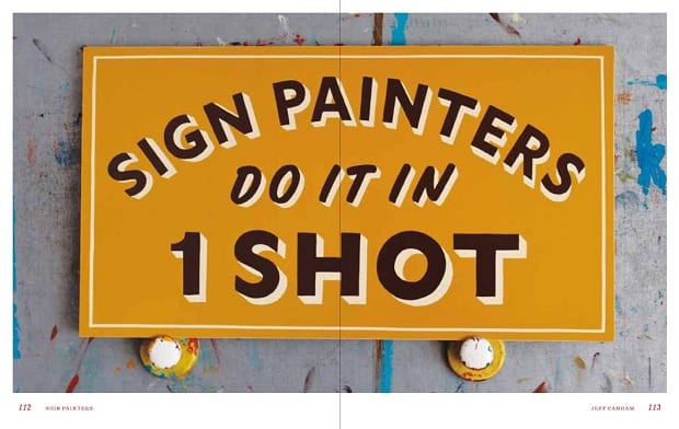 Hand-painted sign saying 'Sign painters do it in 1 shot'