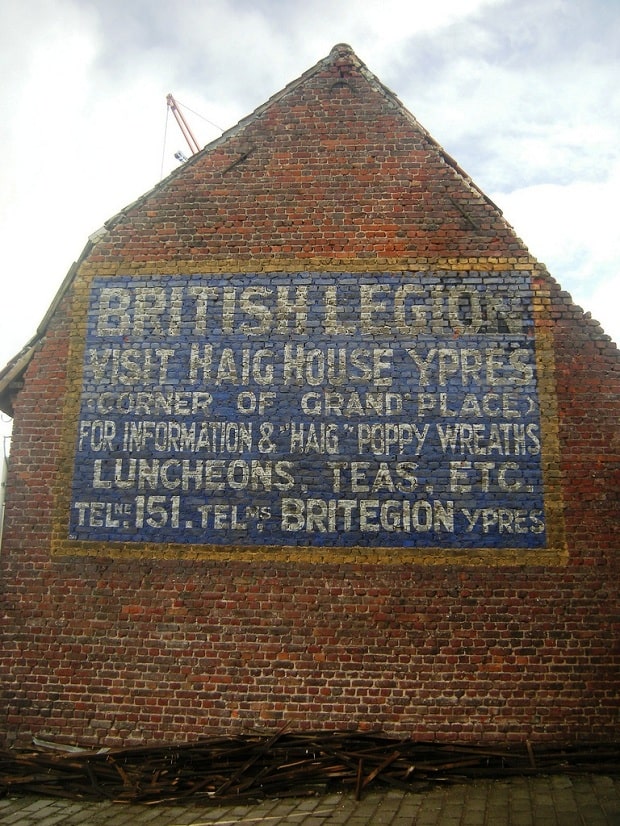 Ghostsign in Ypres, Belgium, advertising details for visitors from the British Legion