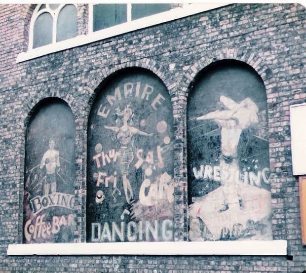 Hand-painted wall sign advertising Empire Dancing