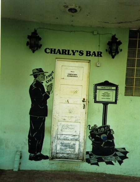 Painted signage on a wall for Charly's Bar