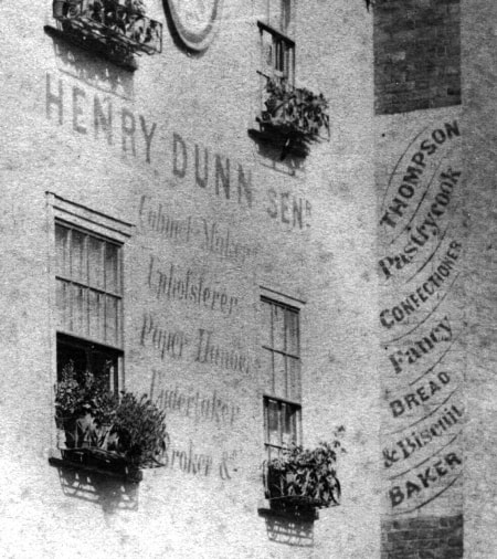 Painted sign on a wall in Deal, Kent, for Henry Dunn's furniture shop
