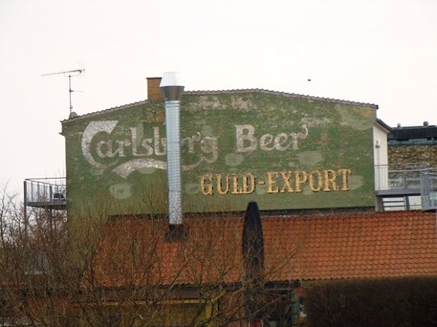 Fading painted sign on a wall advertising Carlsberg