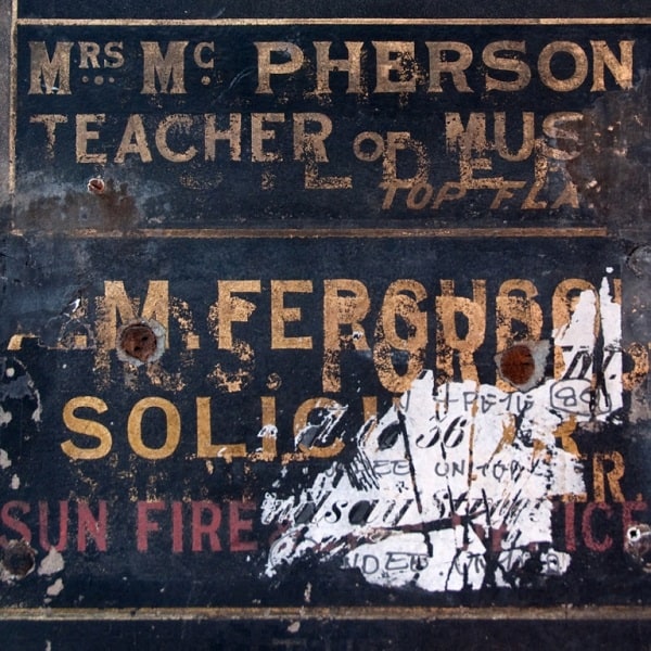 Gold painted sign for Mrs McPherson, Teacher of Music