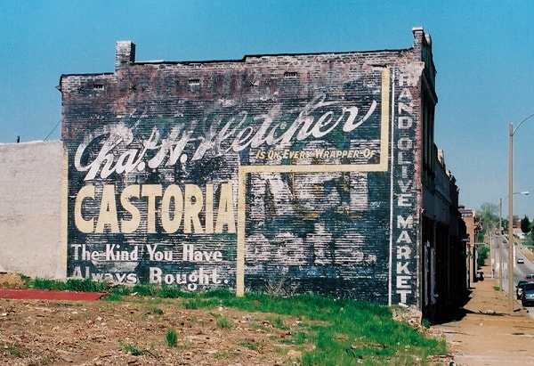 Fading painted advertising for Castoria on a wall