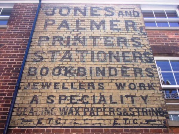 Painted sign on brick for Jones and Palmer