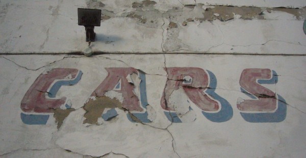 Detail of painted sign showing the word 'Car'