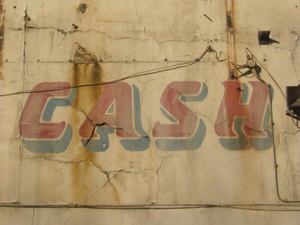 Detail of painted sign showing the word 'Cash'