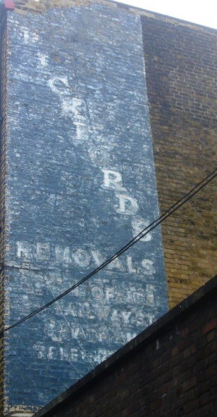Fading sign on wall for Pickfords Removals