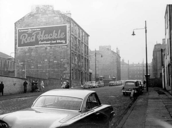 Sign for Red Hackle Whisky in 1960s photograph