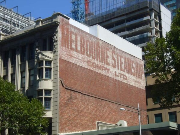 Painted sign fading on a wall advertising the Melbourne Steamship Company