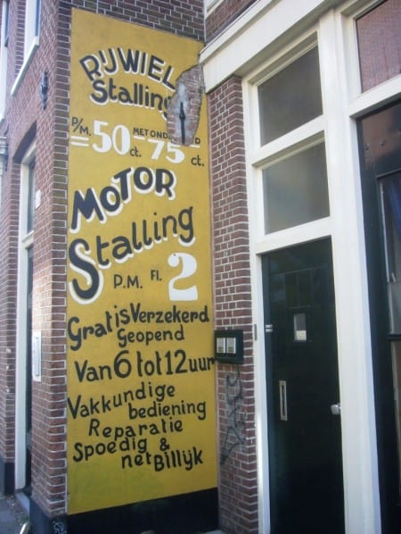 Painted sign on a wall for Motor Stalling