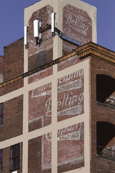 Fading advertisement on a wall advertising the Philadelphia Belting Company