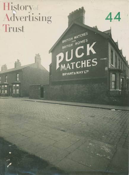 Painted advertisement on a gable end for Puck Matches