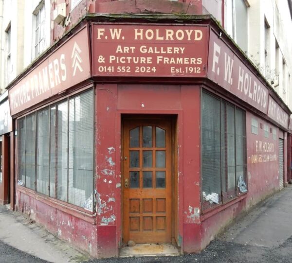 Painted signage on shopfront for F.W. Holroyd