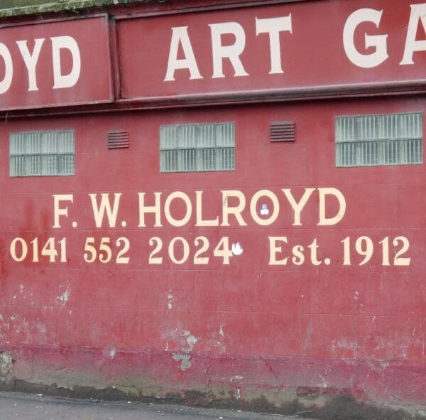 Painted signage on wall for F.W. Holroyd