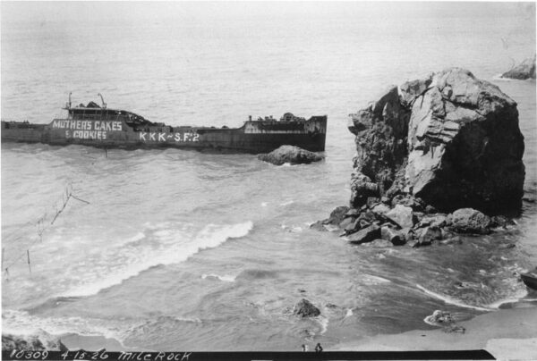 From The Western Neighborhoods Project: Three and half years after running aground, the Lyman Stewart sits in the surf covered with graffiti. It would stay there until around 1938. Helmet Rock at right. DPW 1039 (Courtesy of a Private Collector)
