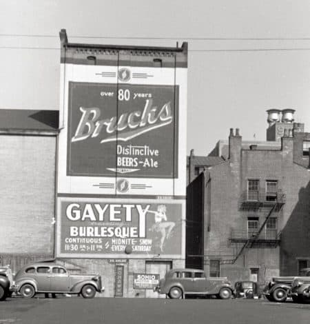 Photo by John Vachon/Library of Congress, depicting a street in Cincinnati in 1938, with sign firm Ed Gelke's name visible beneath the two signs.