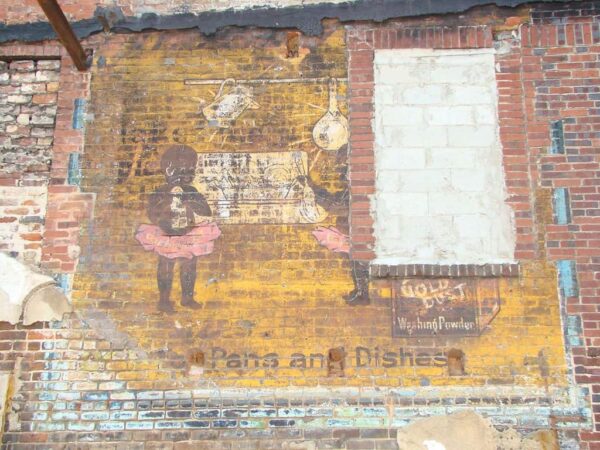 Fading painted advertisement on wall advertising Gold Dust Washing Powder