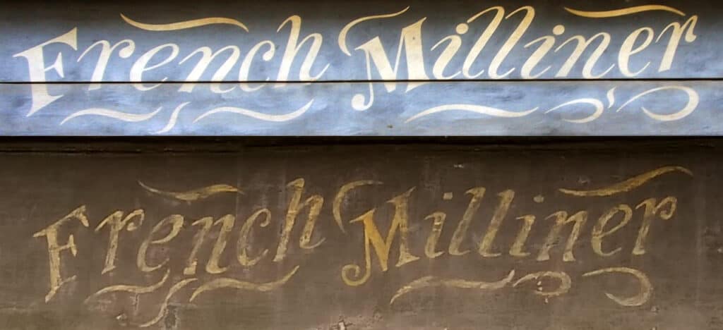 Two French Milliner signs side by side