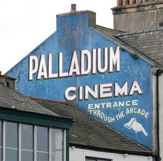 Fading repainted sign for Palladium Cinema.