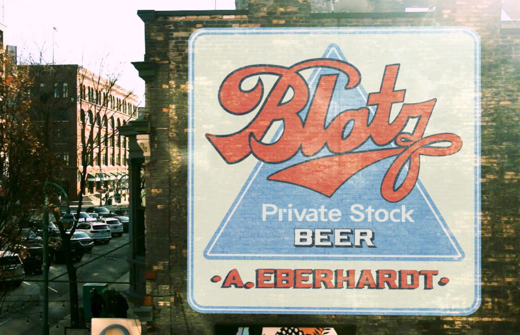 Contemporary view of the previous building from the side and showing a graphic for the beer sign mapped onto the wall that hosts the ghost sign.